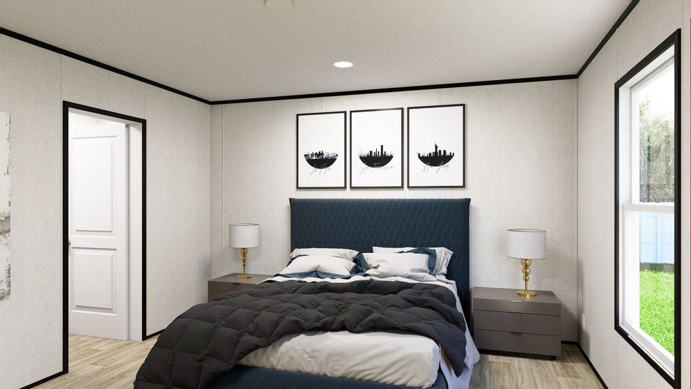 The SOLACE Primary Bedroom. This Manufactured Mobile Home features 4 bedrooms and 2 baths.