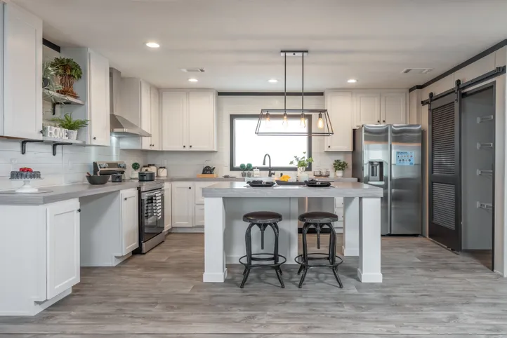 The BREEZE FARMHOUSE Kitchen. This Manufactured Mobile Home features 3 bedrooms and 2 baths.