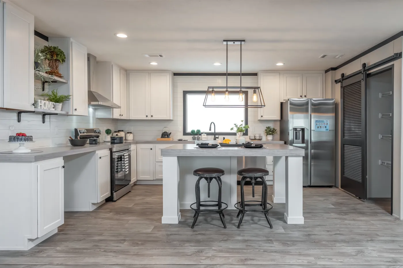 The BREEZE FARMHOUSE Kitchen. This Manufactured Mobile Home features 3 bedrooms and 2 baths.