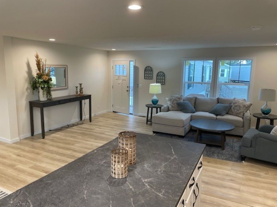 The MICHIGAN AVE/6028-MS026-1 SECT Living Room. This Manufactured Mobile Home features 3 bedrooms and 2 baths.