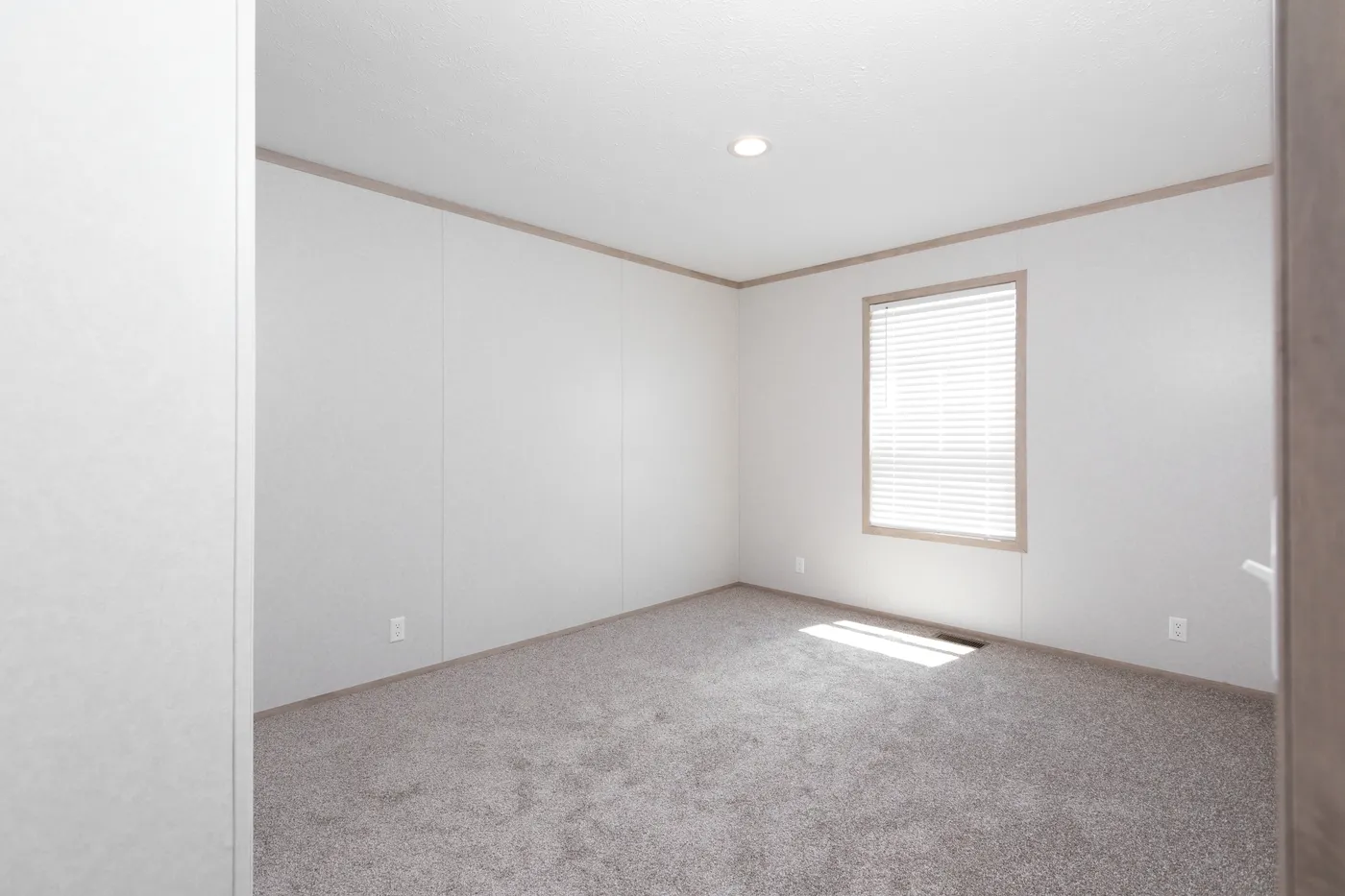 The 6032-5700 THE PULSE Guest Bedroom. This Manufactured Mobile Home features 3 bedrooms and 2 baths.