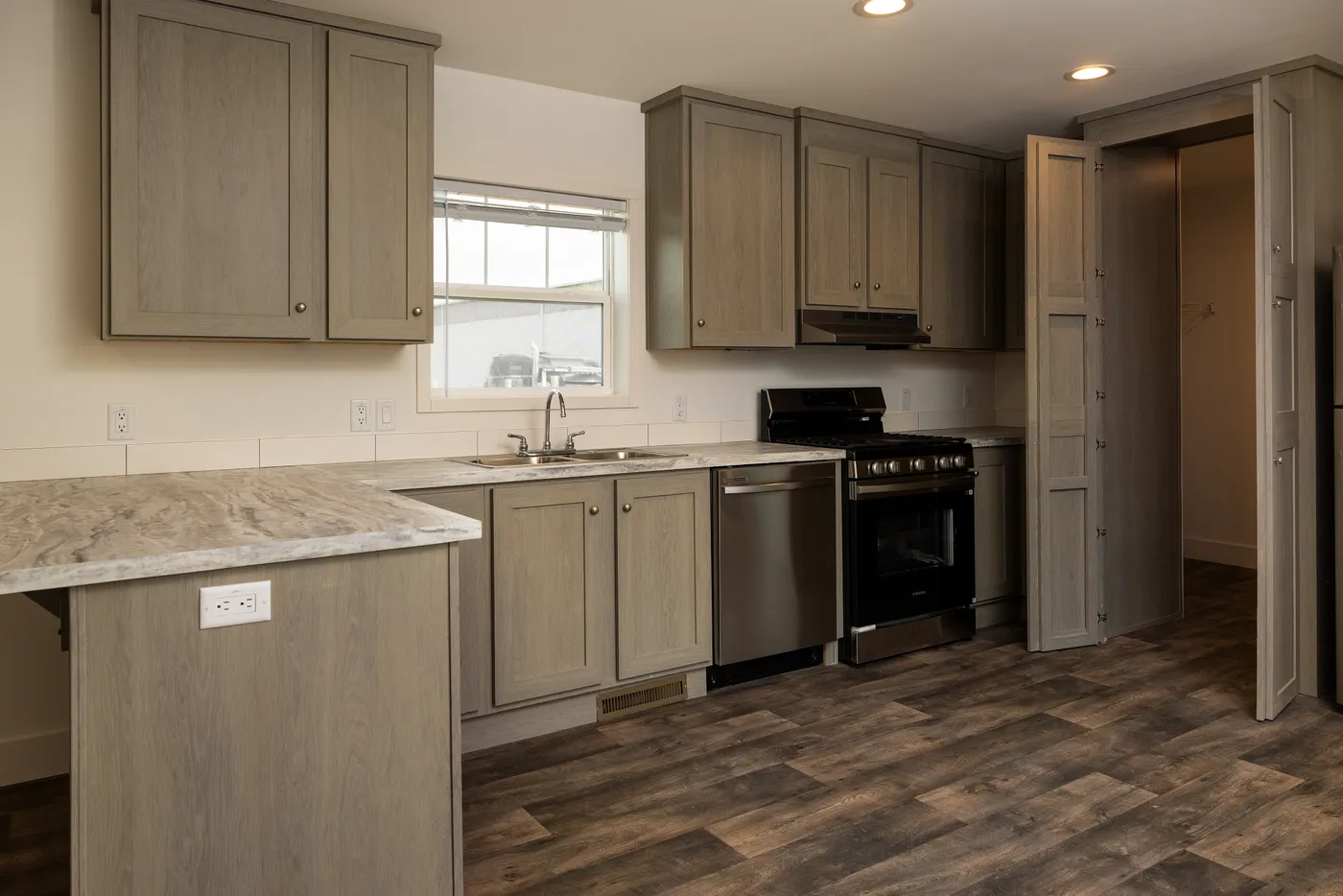 The RAMSEY 223 Kitchen. This Manufactured Mobile Home features 3 bedrooms and 2 baths.