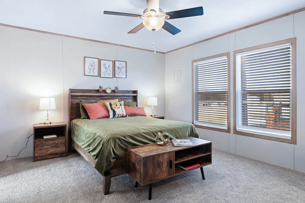 The BLUEBONNET BREEZE Primary Bedroom. This Manufactured Mobile Home features 3 bedrooms and 2 baths.