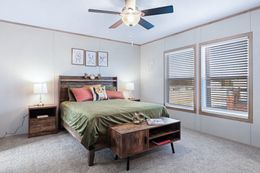 The BLUEBONNET BREEZE Primary Bedroom. This Manufactured Mobile Home features 3 bedrooms and 2 baths.