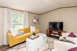 The CELEBRATION Living Room. This Manufactured Mobile Home features 3 bedrooms and 2 baths.