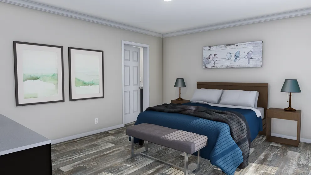 The CAROLINIAN M5000 Primary Bedroom. This Manufactured Mobile Home features 3 bedrooms and 2 baths.