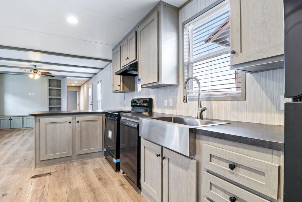 The ANNIVERSARY 16763A Exterior. This Manufactured Mobile Home features 3 bedrooms and 2 baths.