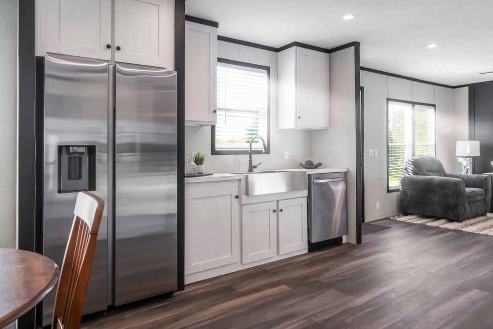 The LIL SOUTHERN CHARM Kitchen. This Manufactured Mobile Home features 3 bedrooms and 2 baths.