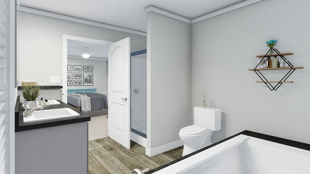The CASTLE PINES Primary Bathroom. This Manufactured Mobile Home features 3 bedrooms and 2 baths.