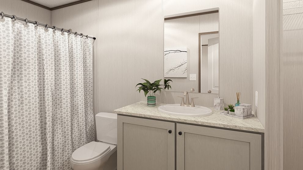 The LEGEND 16X72 COASTAL BREEZE I Primary Bathroom. This Manufactured Mobile Home features 3 bedrooms and 2 baths.