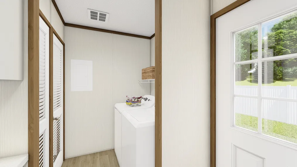 The THE ESSENCE Utility Room. This Manufactured Mobile Home features 3 bedrooms and 2 baths.