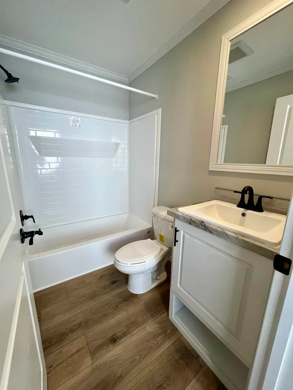 The THE TRUMAN Guest Bathroom. This Manufactured Mobile Home features 3 bedrooms and 2 baths.