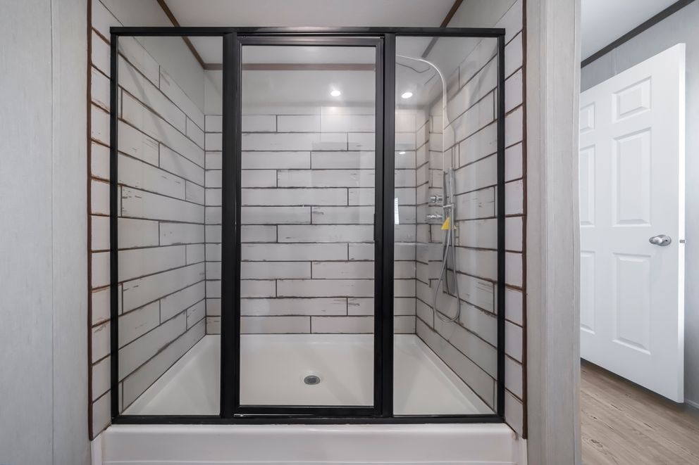 The SEAS THE DAY Primary Bathroom. This Manufactured Mobile Home features 3 bedrooms and 2 baths.