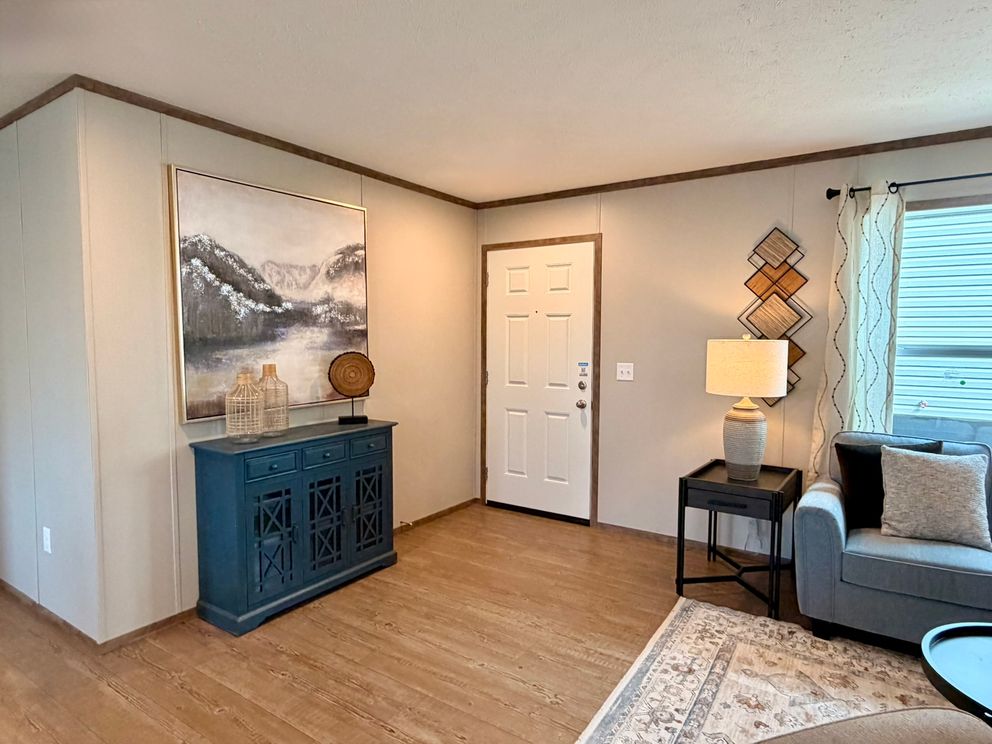 The APATITE Living Room. This Manufactured Mobile Home features 3 bedrooms and 2 baths.
