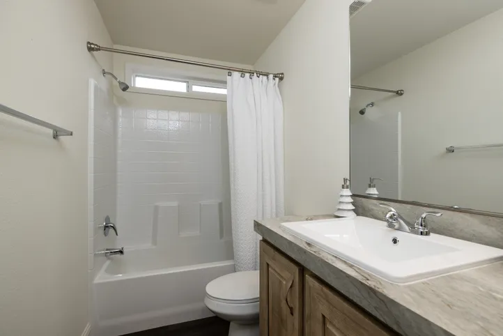 The FAIRPOINT 20382B Guest Bathroom. This Manufactured Mobile Home features 2 bedrooms and 2 baths.