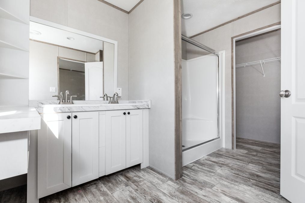 The TRUMAN Primary Bathroom. This Manufactured Mobile Home features 4 bedrooms and 2 baths.