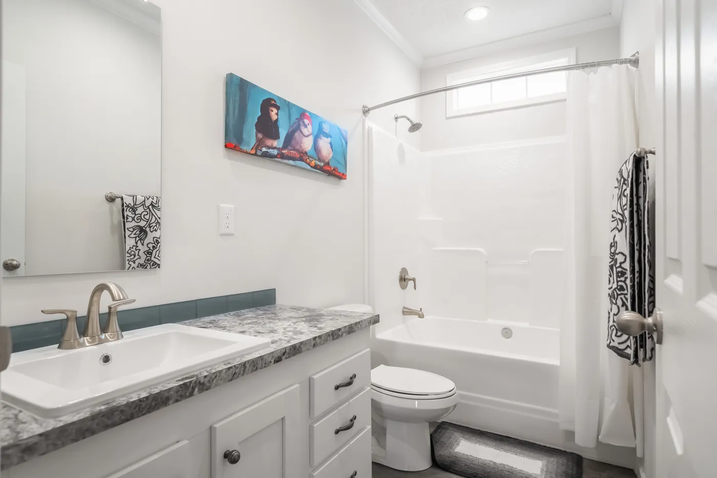 The 3458 MOD 76X32 CAROLINA RAELYN Guest Bathroom. This Modular Home features 4 bedrooms and 3 baths.