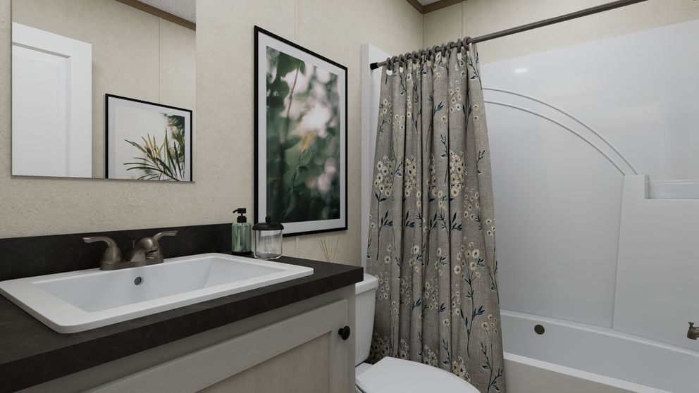 The 7216-CC03 HARBORVIEW 72 Guest Bathroom. This Manufactured Mobile Home features 3 bedrooms and 2 baths.