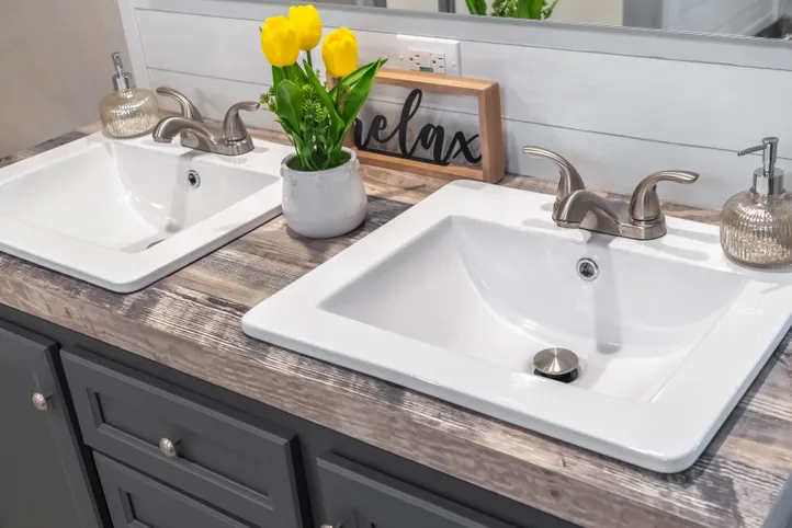 The ANNIVERSARY CHOICE Primary Bathroom. This Manufactured Mobile Home features 3 bedrooms and 2 baths.