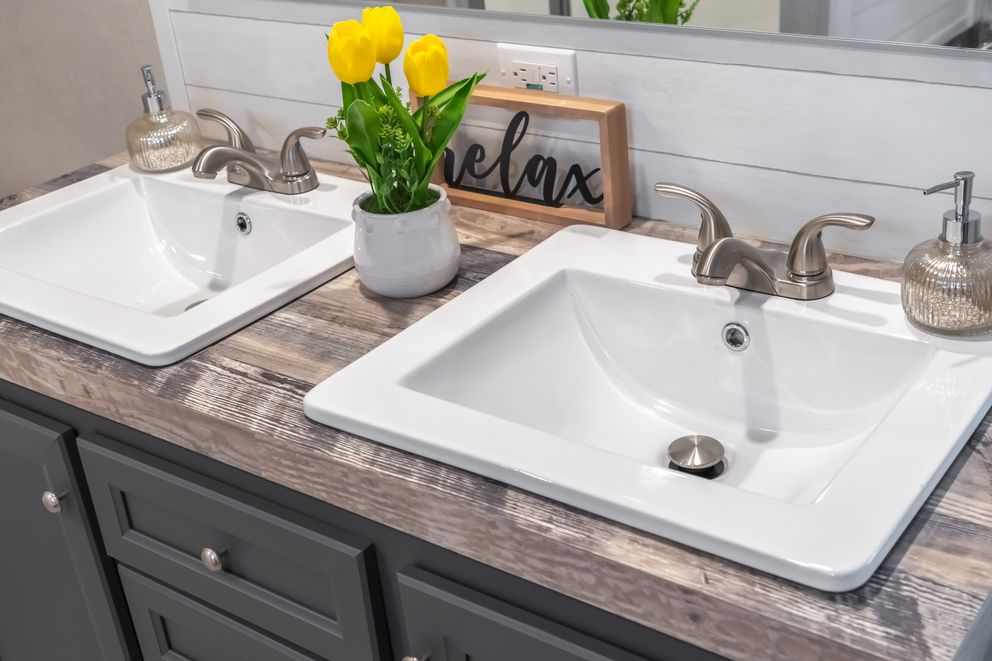 The ANNIVERSARY CHOICE Primary Bathroom. This Manufactured Mobile Home features 3 bedrooms and 2 baths.