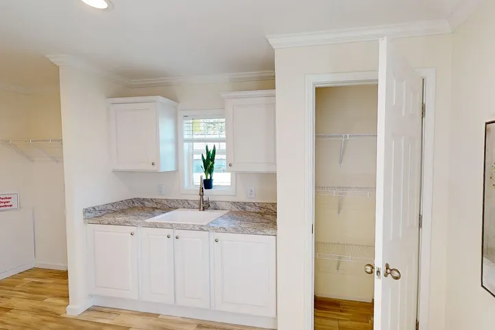 The 4215 "SUNRISE" 6428 Utility Room. This Manufactured Mobile Home features 3 bedrooms and 2 baths.