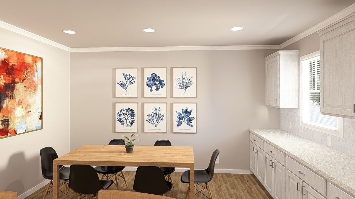 The THE HEXAGON Dining Room. This Manufactured Mobile Home features 4 bedrooms and 3 baths.