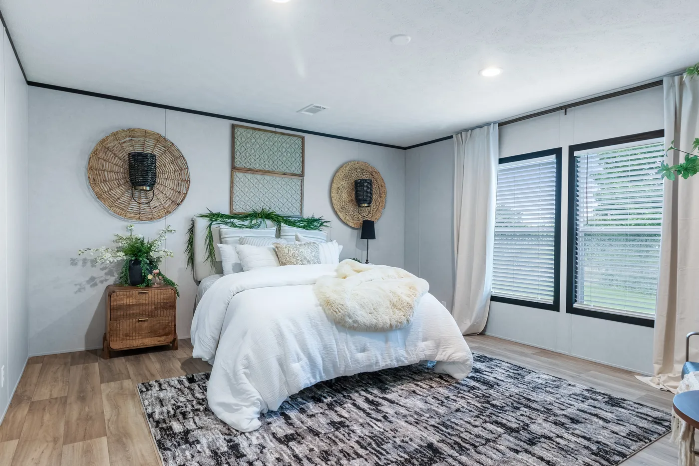 The ODYSSEY Primary Bedroom. This Manufactured Mobile Home features 4 bedrooms and 2 baths.