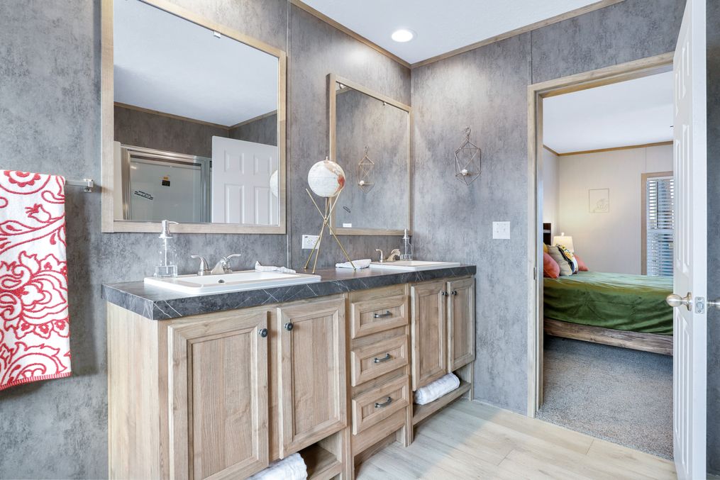 The BLUEBONNET BREEZE Primary Bathroom. This Manufactured Mobile Home features 3 bedrooms and 2 baths.