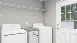 The THE FRANKLIN Utility Room. This Manufactured Mobile Home features 3 bedrooms and 2 baths.