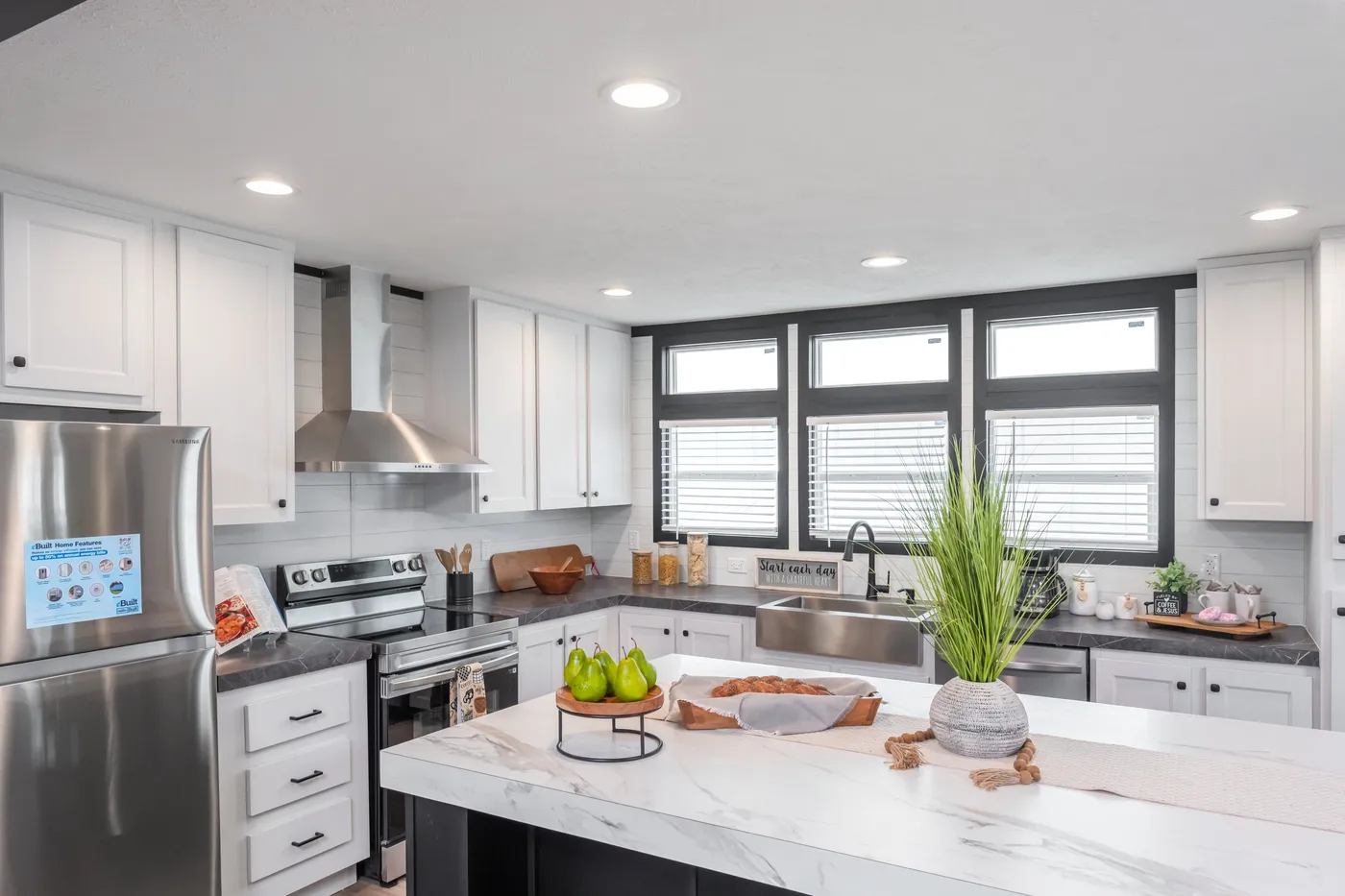 The ABSOLUTE VALUE Kitchen. This Manufactured Mobile Home features 4 bedrooms and 2 baths.