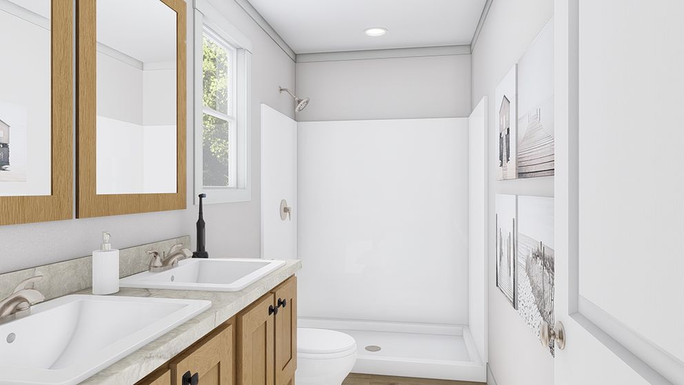 The PURPLE RAIN Primary Bathroom. This Manufactured Mobile Home features 3 bedrooms and 2 baths.