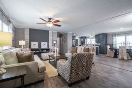 The TRADITION 3268B Living Room. This Manufactured Mobile Home features 5 bedrooms and 3 baths.