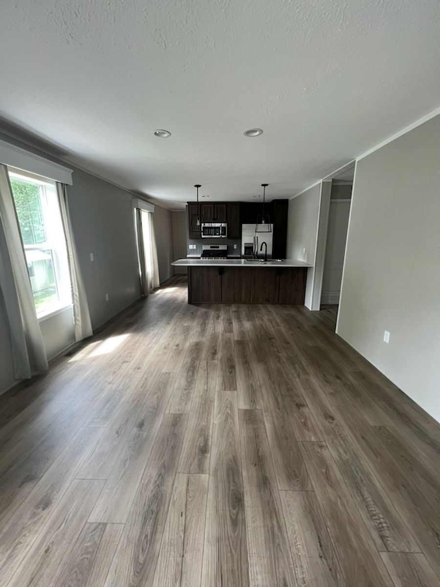 The JADE 40 Living Room. This Manufactured Mobile Home features 2 bedrooms and 2 baths.