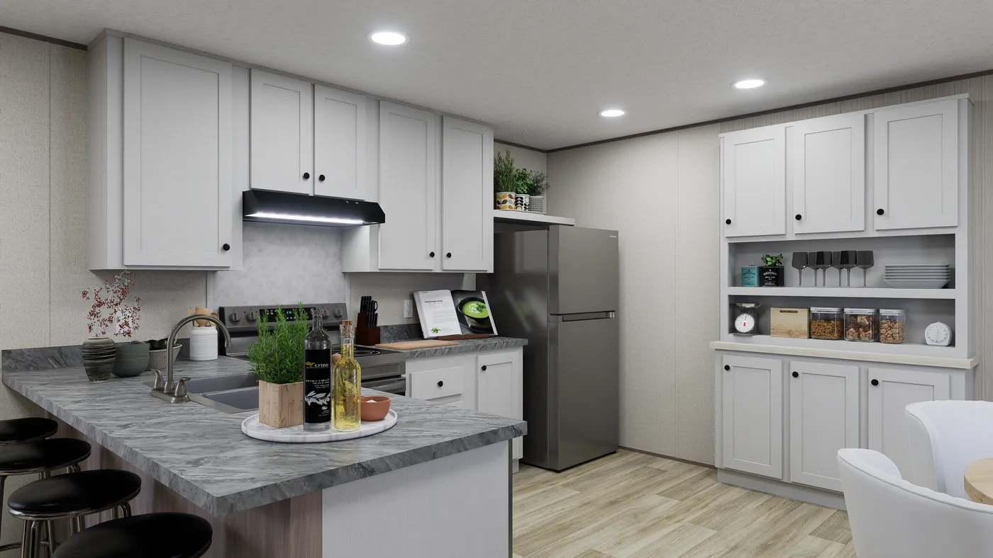 The GLACIER VISTA Kitchen. This Manufactured Mobile Home features 4 bedrooms and 2 baths.