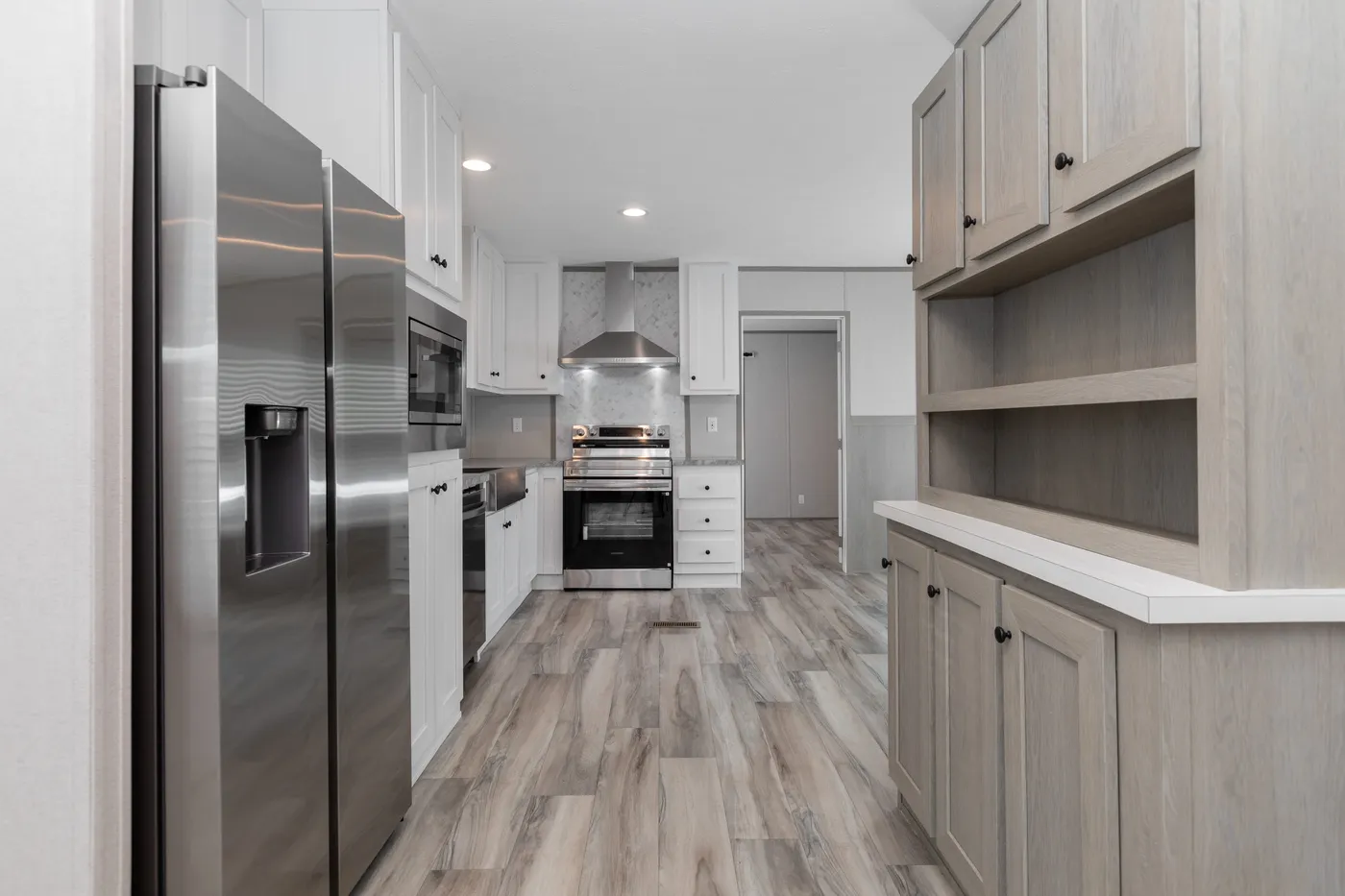 The THE ULTIMATE SHOWER Kitchen. This Manufactured Mobile Home features 3 bedrooms and 2 baths.