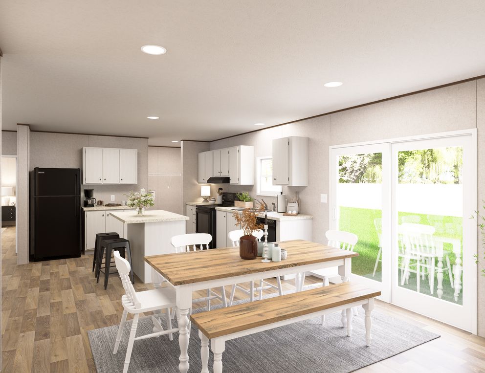 The SYCAMORE Dining Area. This Manufactured Mobile Home features 4 bedrooms and 2 baths.