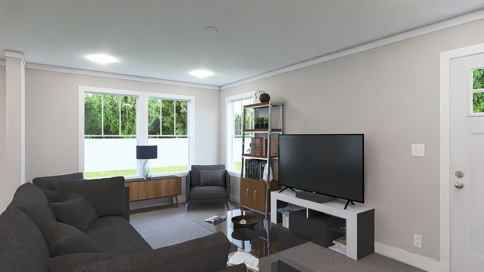 The THREE LITTLE BIRDS Living Room. This Manufactured Mobile Home features 3 bedrooms and 2 baths.