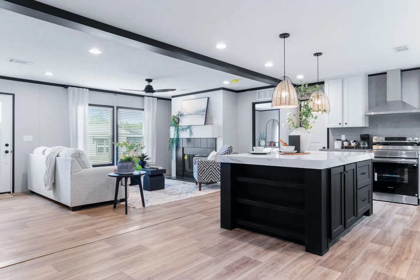 The ABSOLUTE VALUE Living Room. This Manufactured Mobile Home features 4 bedrooms and 2 baths.