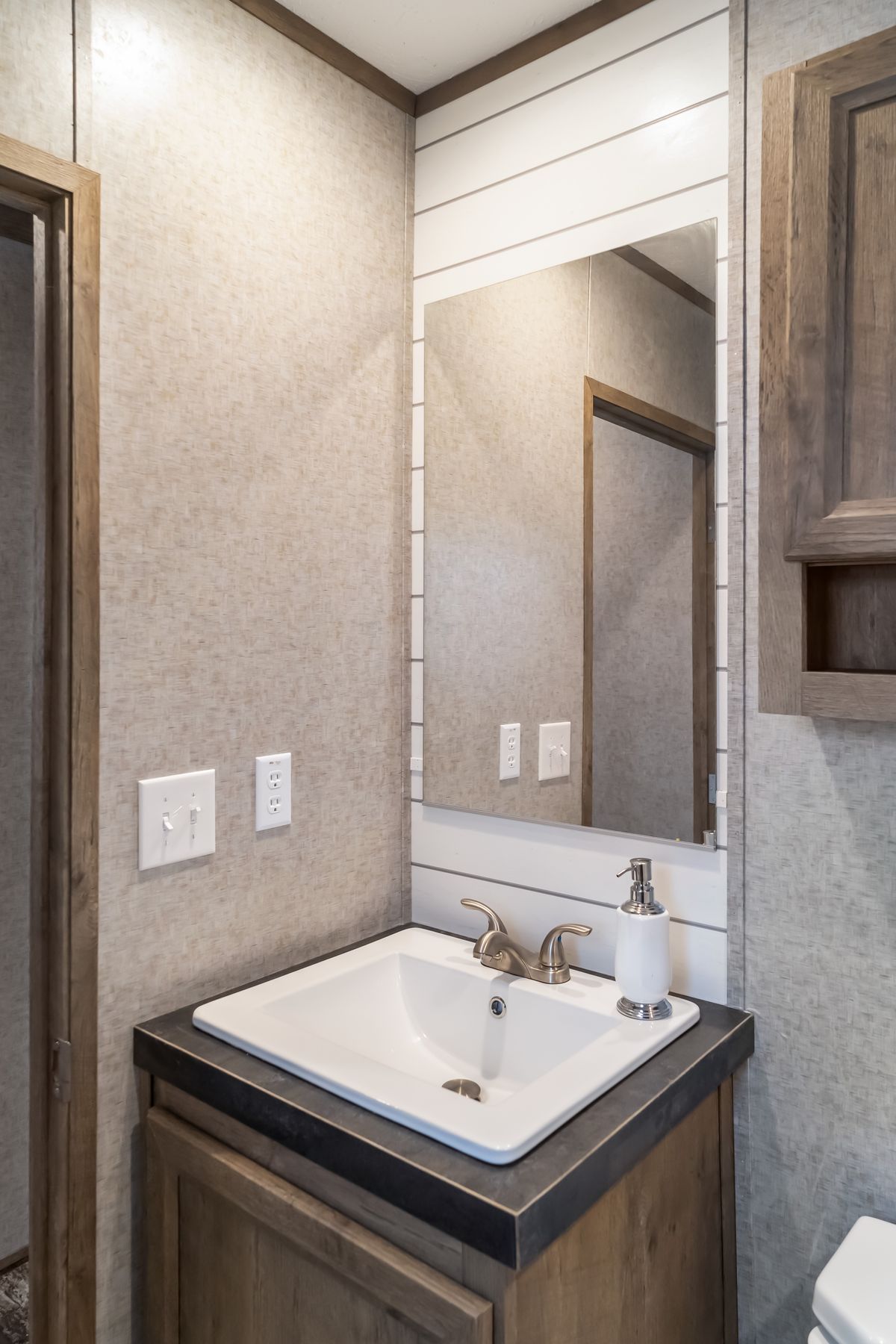 The MAJOR Guest Bathroom. This Manufactured Mobile Home features 3 bedrooms and 2 baths.