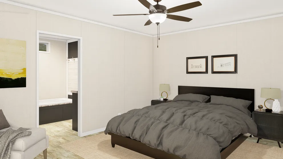 The GRAND LIVING 76B Primary Bedroom. This Manufactured Mobile Home features 3 bedrooms and 2 baths.