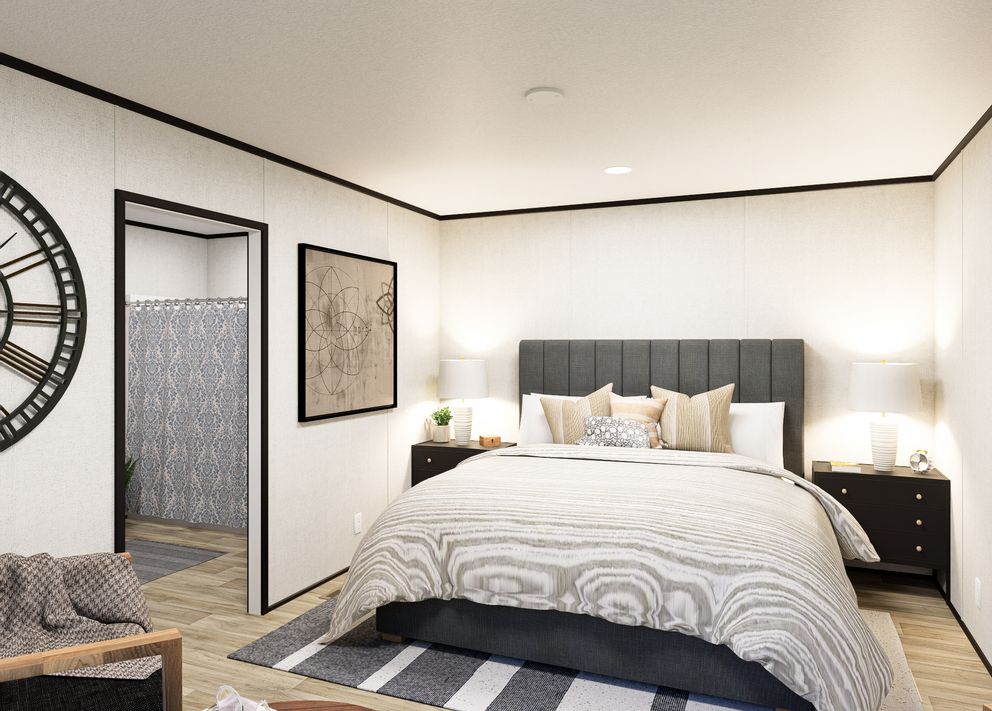 The NORTHSTAR Primary Bedroom. This Manufactured Mobile Home features 3 bedrooms and 2 baths.