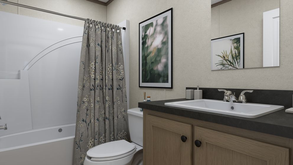 The 5628-CC52 COMPASS 56 Guest Bathroom. This Manufactured Mobile Home features 3 bedrooms and 2 baths.