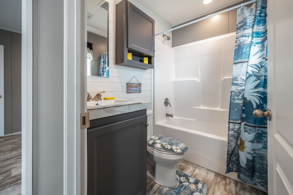 The MAJOR Guest Bathroom. This Manufactured Mobile Home features 3 bedrooms and 2 baths.