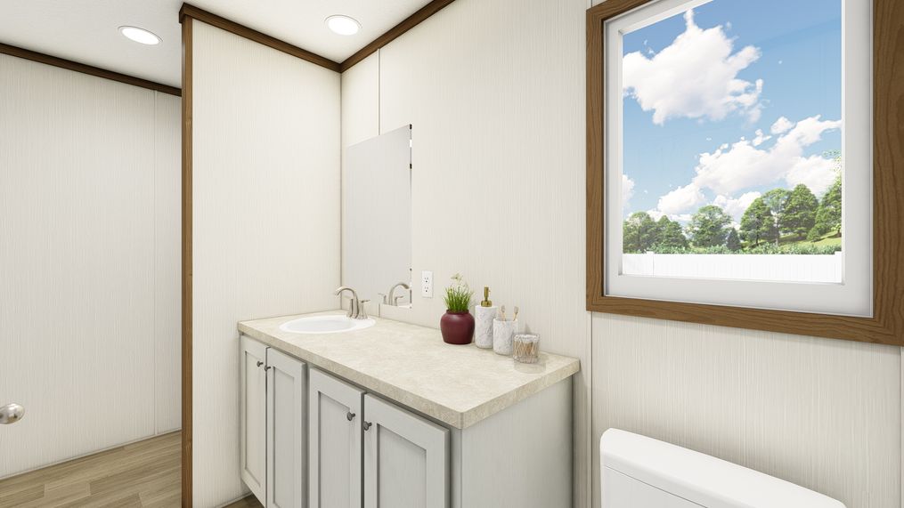 The DYNAMIC Primary Bathroom. This Manufactured Mobile Home features 3 bedrooms and 2 baths.