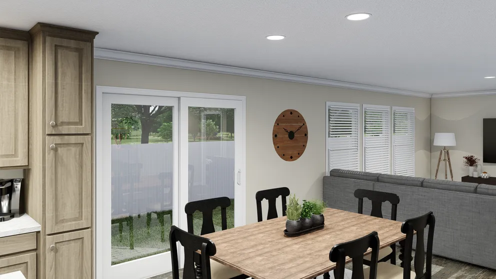 The CAROLINIAN M5010 Dining Area. This Manufactured Mobile Home features 3 bedrooms and 2 baths.