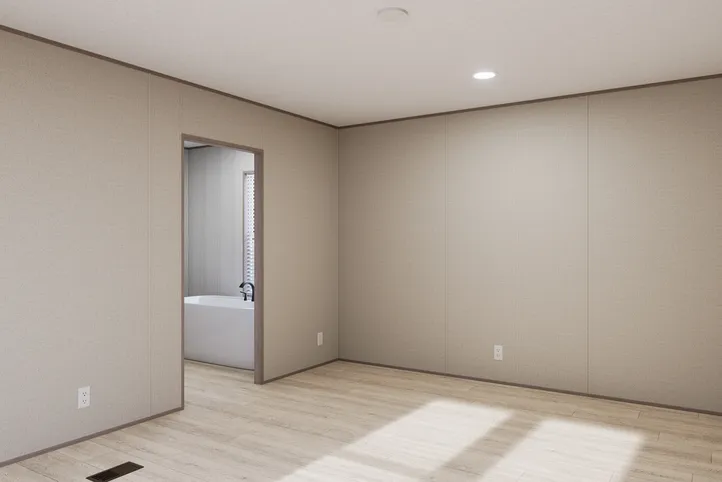 The THE ANNIVERSARY 76 Primary Bedroom. This Manufactured Mobile Home features 3 bedrooms and 2 baths.