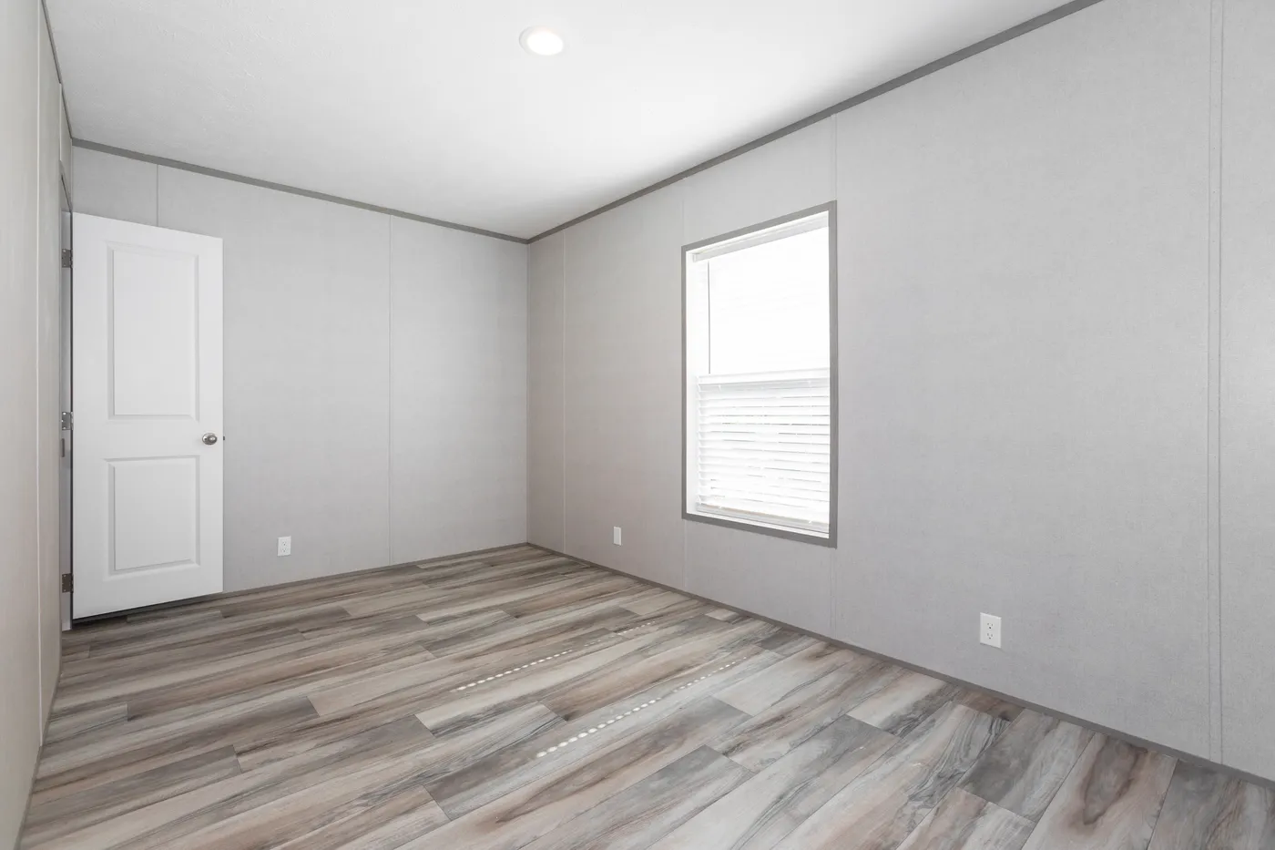 The THE OLYMPUS Guest Bedroom. This Manufactured Mobile Home features 3 bedrooms and 2 baths.