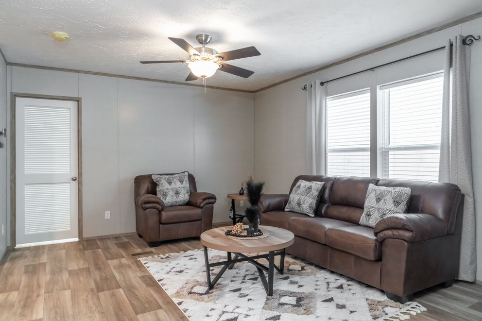 The TRADITION 72 Family Room. This Manufactured Mobile Home features 4 bedrooms and 2 baths.