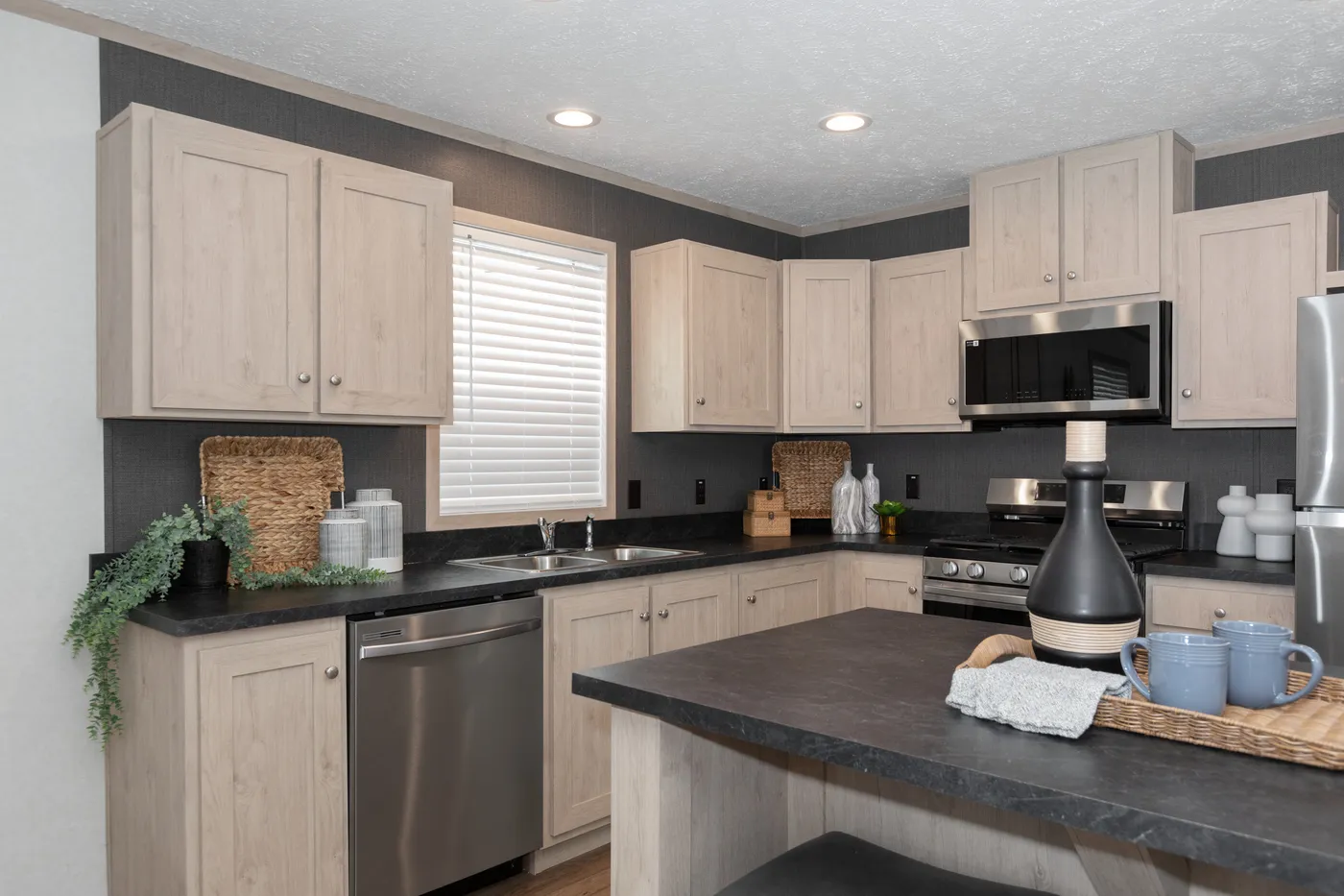 The 7616-4200 ADRENALINE Kitchen. This Manufactured Mobile Home features 3 bedrooms and 2 baths.