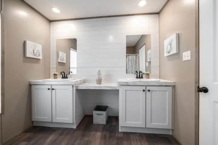 The FARMHOUSE BREEZE 72 Guest Bathroom. This Manufactured Mobile Home features 4 bedrooms and 2 baths.